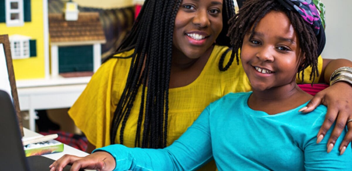 Mother and daughter smiling